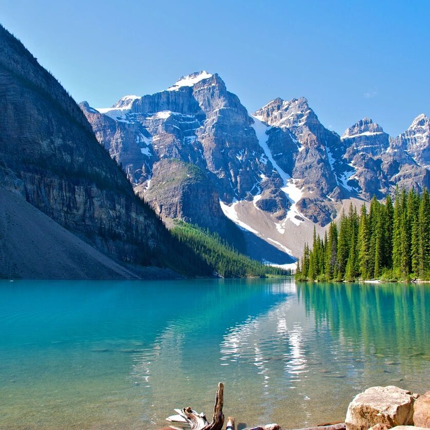 A lake with mountains in the background